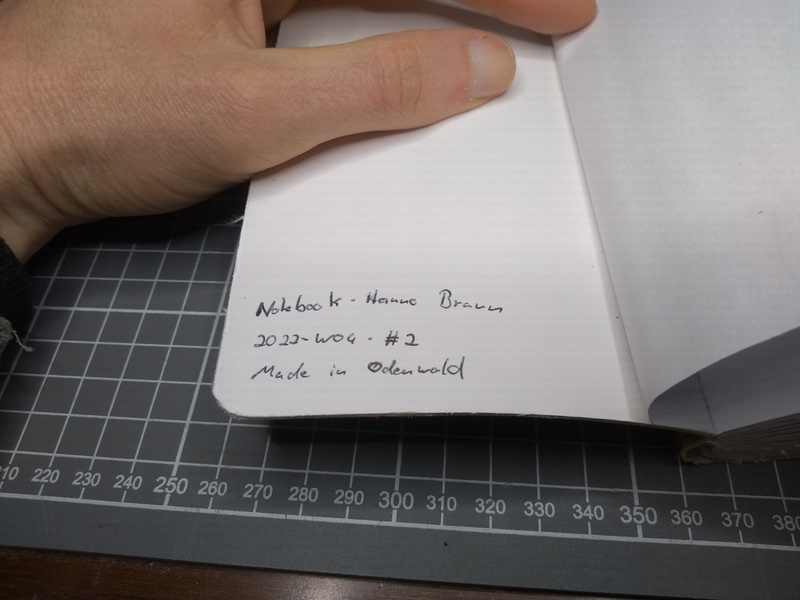 The notebook, showing the following mark on the inside of the cover: Notebook · Hanno Braun · 2022-W04 · #2 · Made in Odenwald