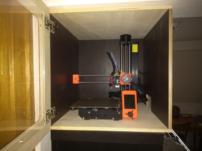 A Prusa Mini in a custom-built enclosure.