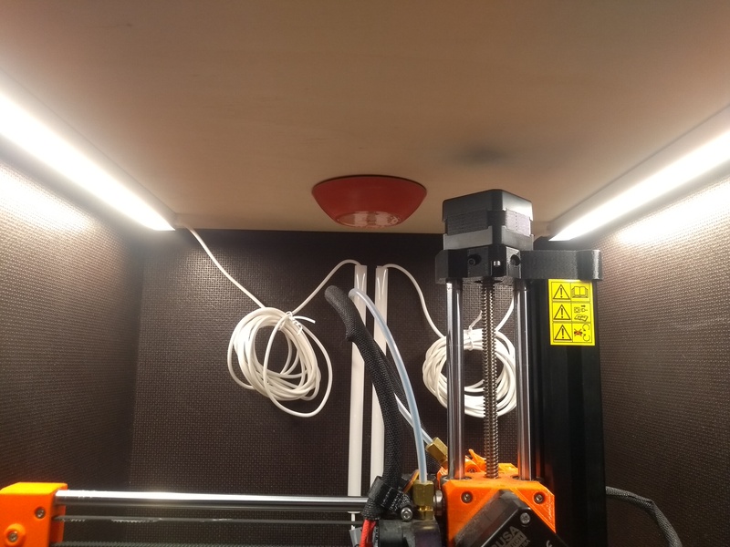 The inside of my printer enclosure, a small self-activating fire extinguisher glued to the roof.